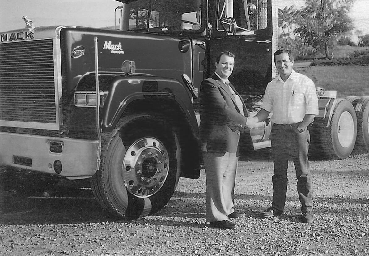 Steve Selvaggio (right) receives his company’s first new heavy-duty vehicle.